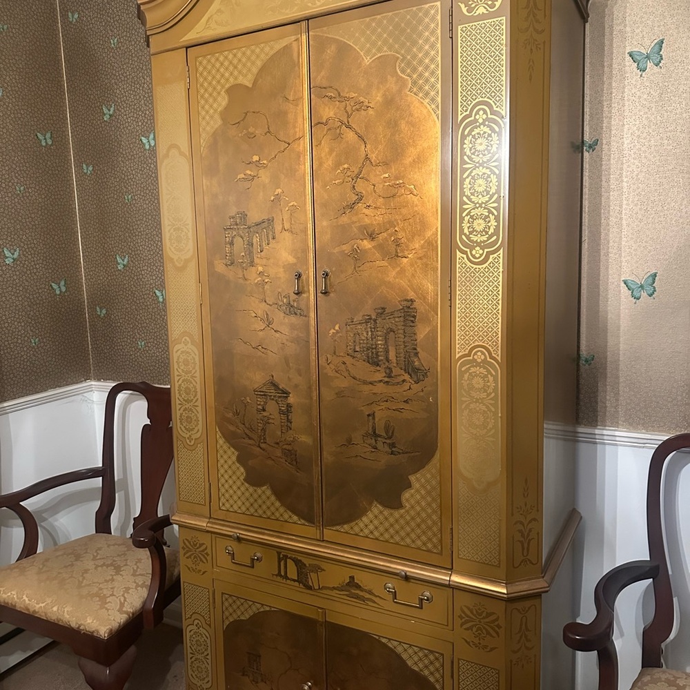 Elegant Gold Armoire with Intricate Design